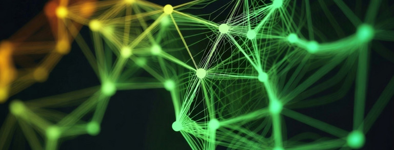 Das Bild zeigt ein Netzwerk aus grün-orange farbigen Knotenpunkten mit Verbindungslinien.